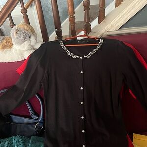 Black button cardigan with pearls and beads around the neck. Worn 1-2 times.
